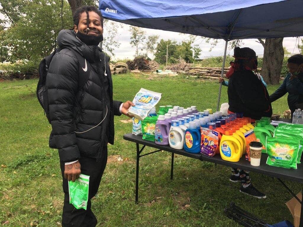 Co-Op Member Mick Mallory at the 1st Community Care Event, where the group gave away almost 200 bottles of laundry detergent.