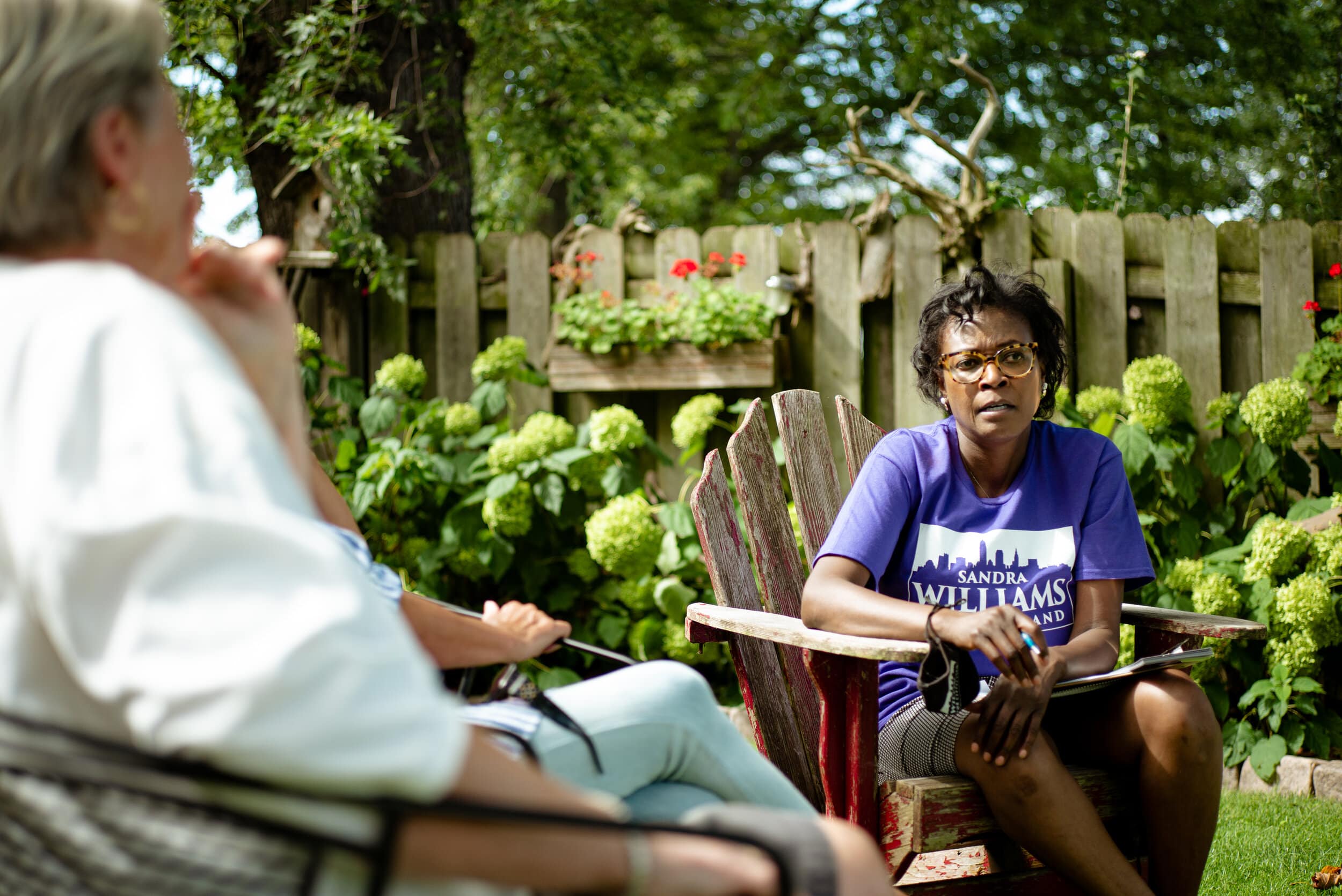Sandra Williams talks with Manhattan Beach residents Lillian Grand and Evelyn Bute in Bute’s backyard on Saturday, Sept. 4, 2020.