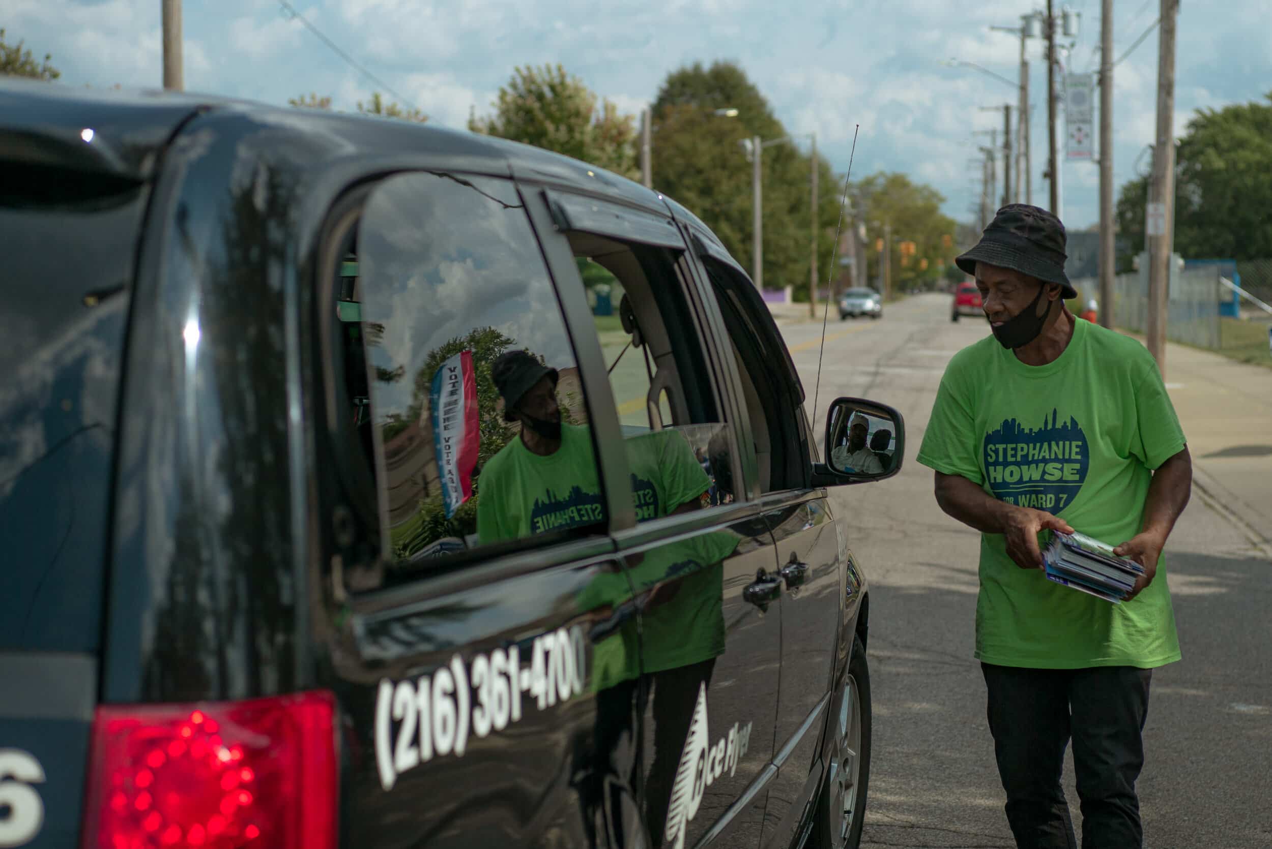 Delvin (Curtis) Brantly hands out Stephanie Howse flyers to passersby outside the Fatima Family Center on Tuesday, Sept. 14, 2021. Photo by Michael Indriolo