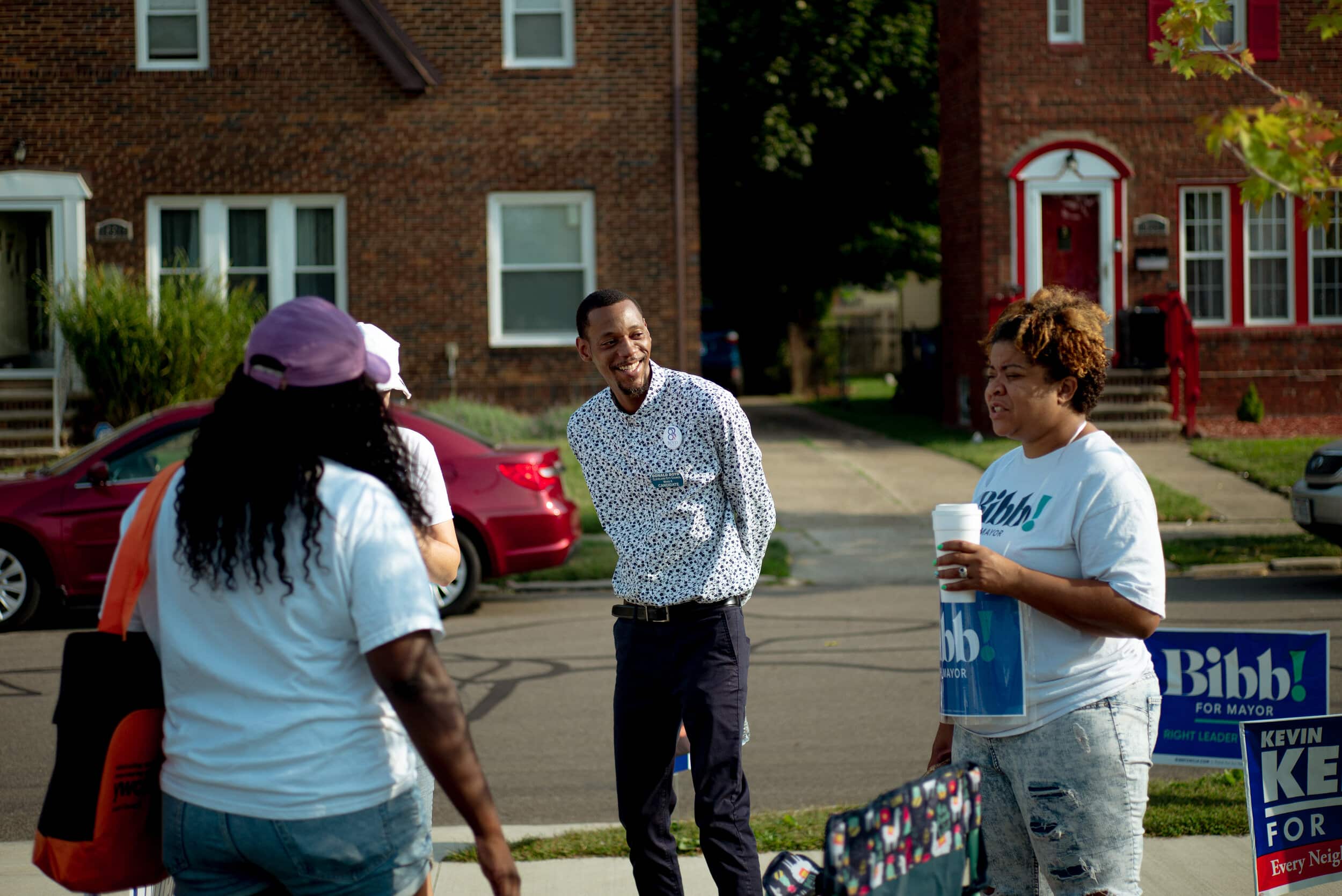 Ward 8 city council candidate Donald Boyd chats with his campaigners during a lull in voters at the Oliver Hazard Perry elementary school on Tuesday, Sept. 14, 2021. Photo by Michael Indriolo