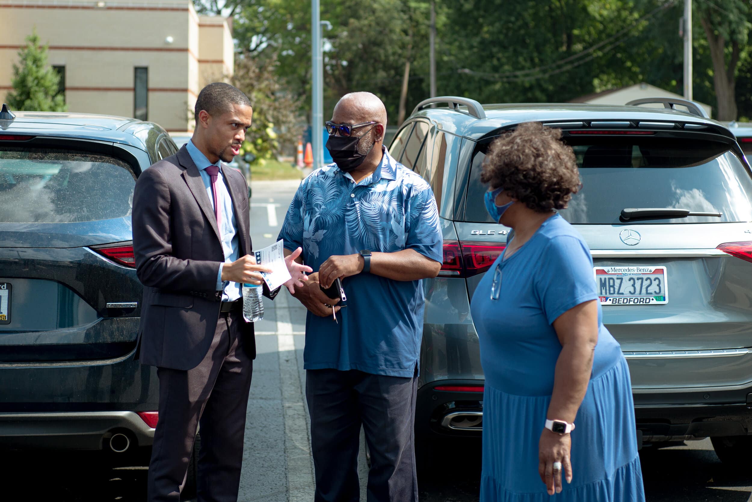 Ward 7 City council candidate Daniel Graves greets Steven and Wanda Best and they head into the Fatima Family Center to vote on Tuesday, Sept. 14, 2021. Photo by Michael Indriolo