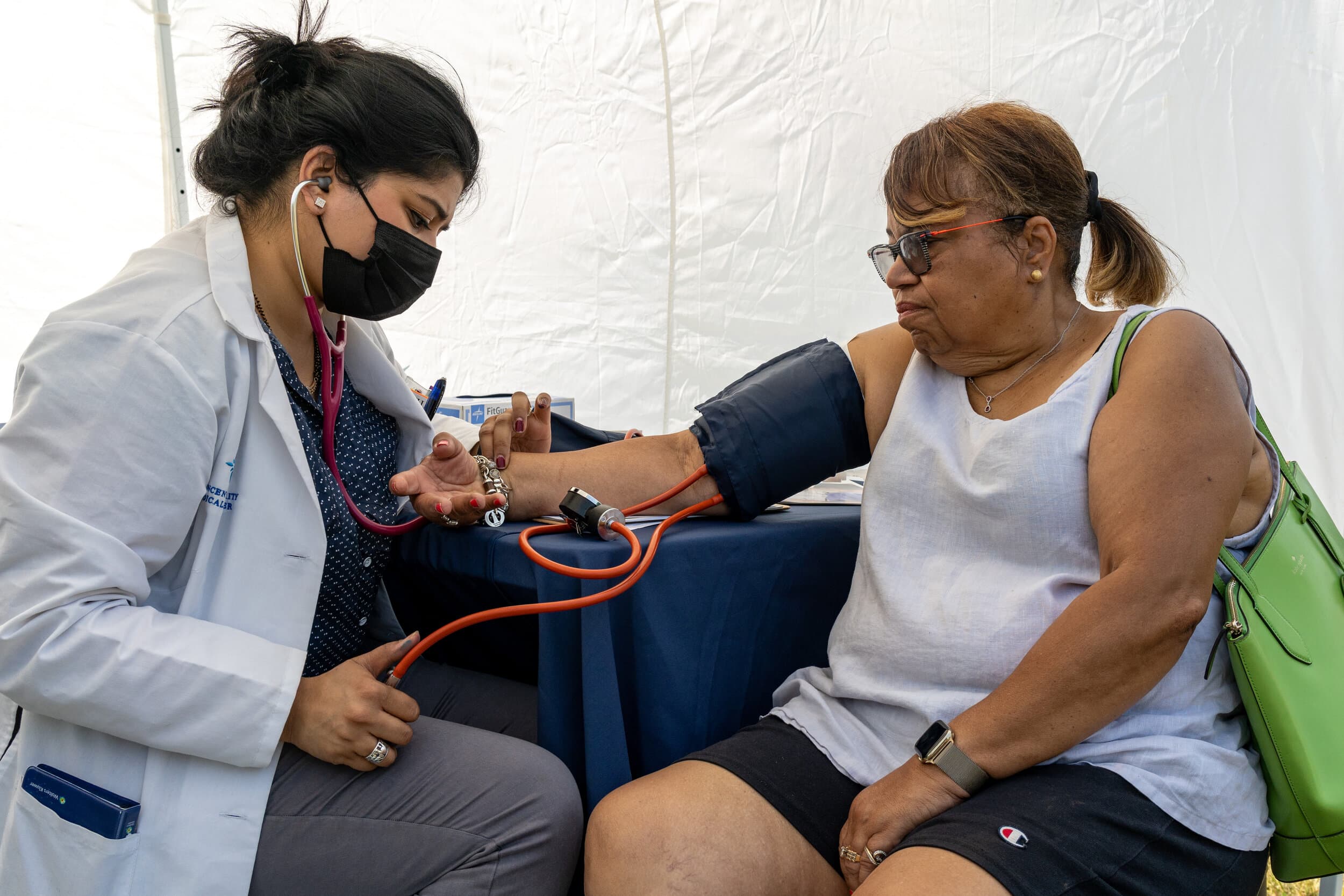 A visitor to a C.O.P.E. event gets a blood pressure check. Contributed photo from C.O.P.E.