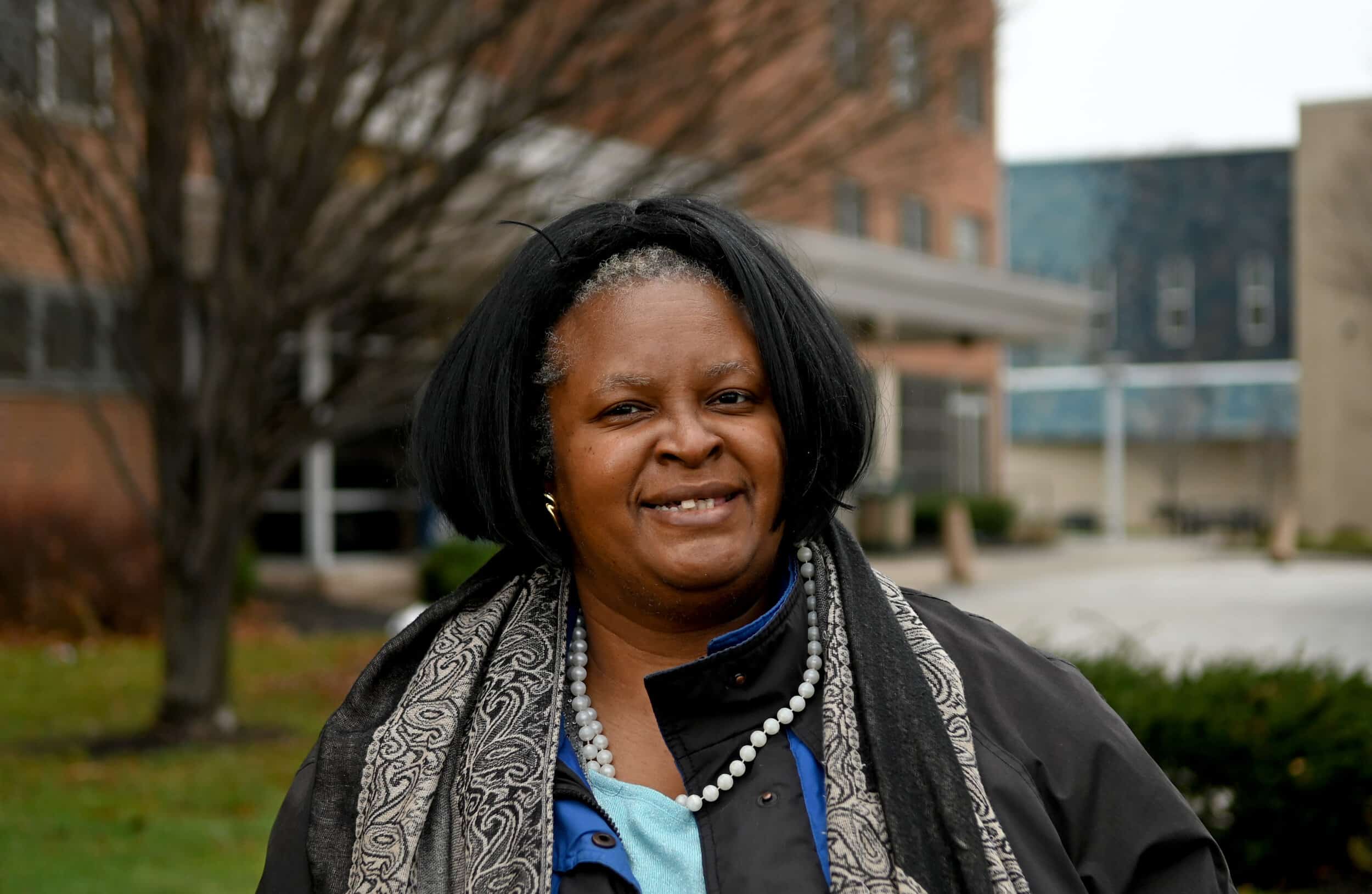 Angela Smith, 48, outside the Cedar Extension High-Rise senior apartments, where she lives with her mother, Minnie. Photo: Tim Harrison