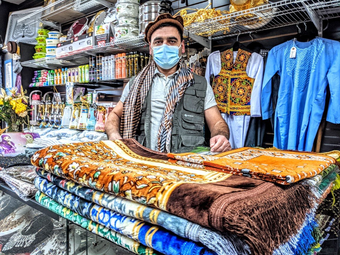 Asia Star, Nasrullah Stafi models clothes from his native Afghanistan. Photo: Grant Segall.