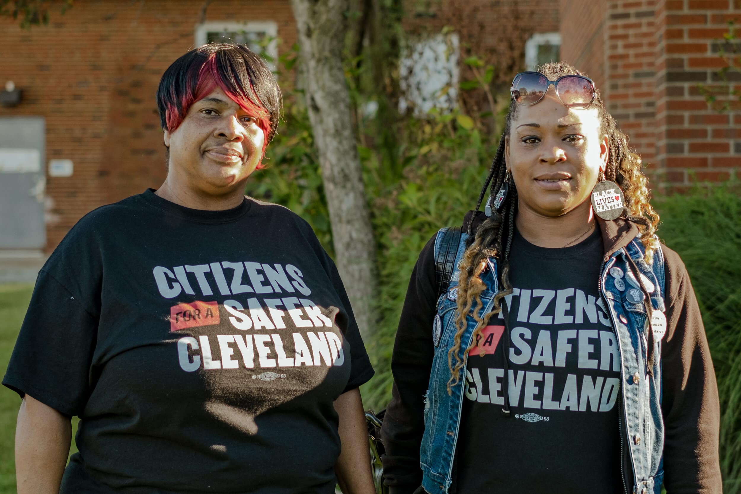Brenda Bickerstaff (left) and LaTonya Goldsby (right) stand outside the Harvard Community Services Center in Lee-Harvard ahead of a community conversation about Issue 24’s proposed charter amendment on Tuesday, Sept. 28, 2021.