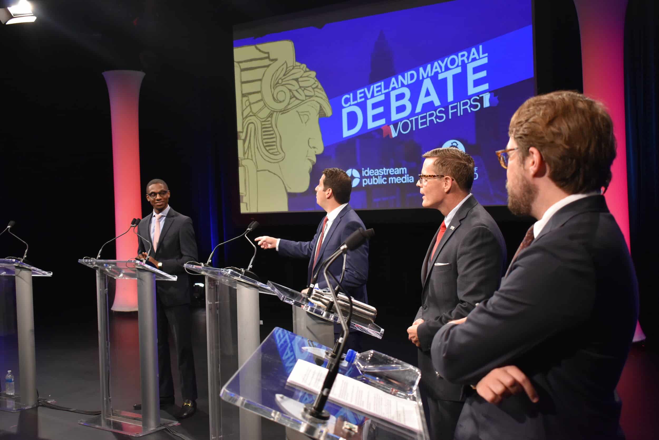 From left to right, Cleveland mayoral candidates Justin Bibb, Ross DiBello, Kevin Kelley and moderator Nick Castele. Photo by Conor Morris.