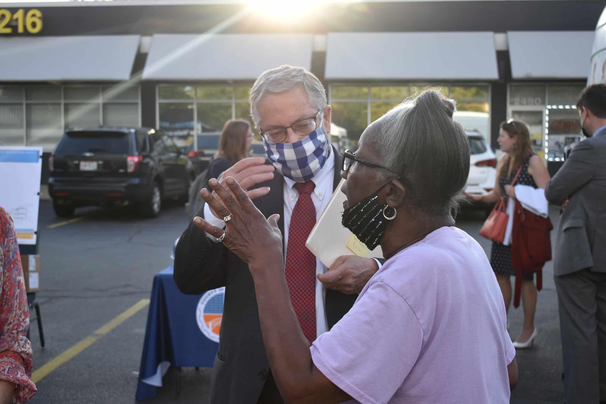 County Executive Armond Budish speaks to a resident during the event in the Central neighborhood. Photo by Conor Morris.