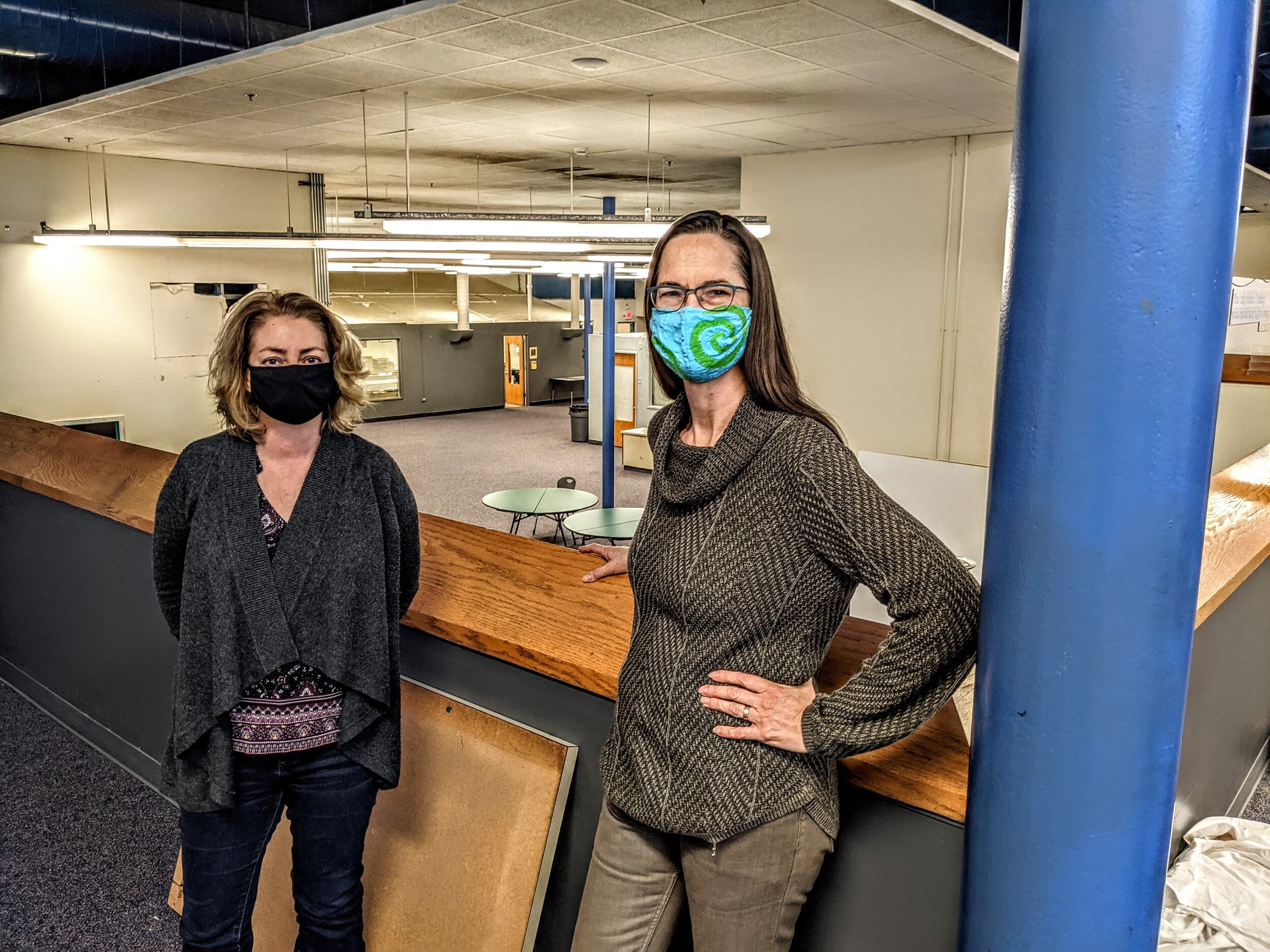 Deanna Bremer Fisher of  FutureHeights, left,  and Krista Hawthorne of ReachingHeights work at the Coventry PEACE Campus. Photo by Grant Segall.