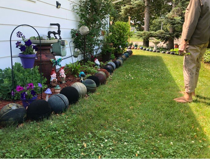 Bowling ball decor at a garden in Collinwood. Photo courtesy Gabrielle Woods.