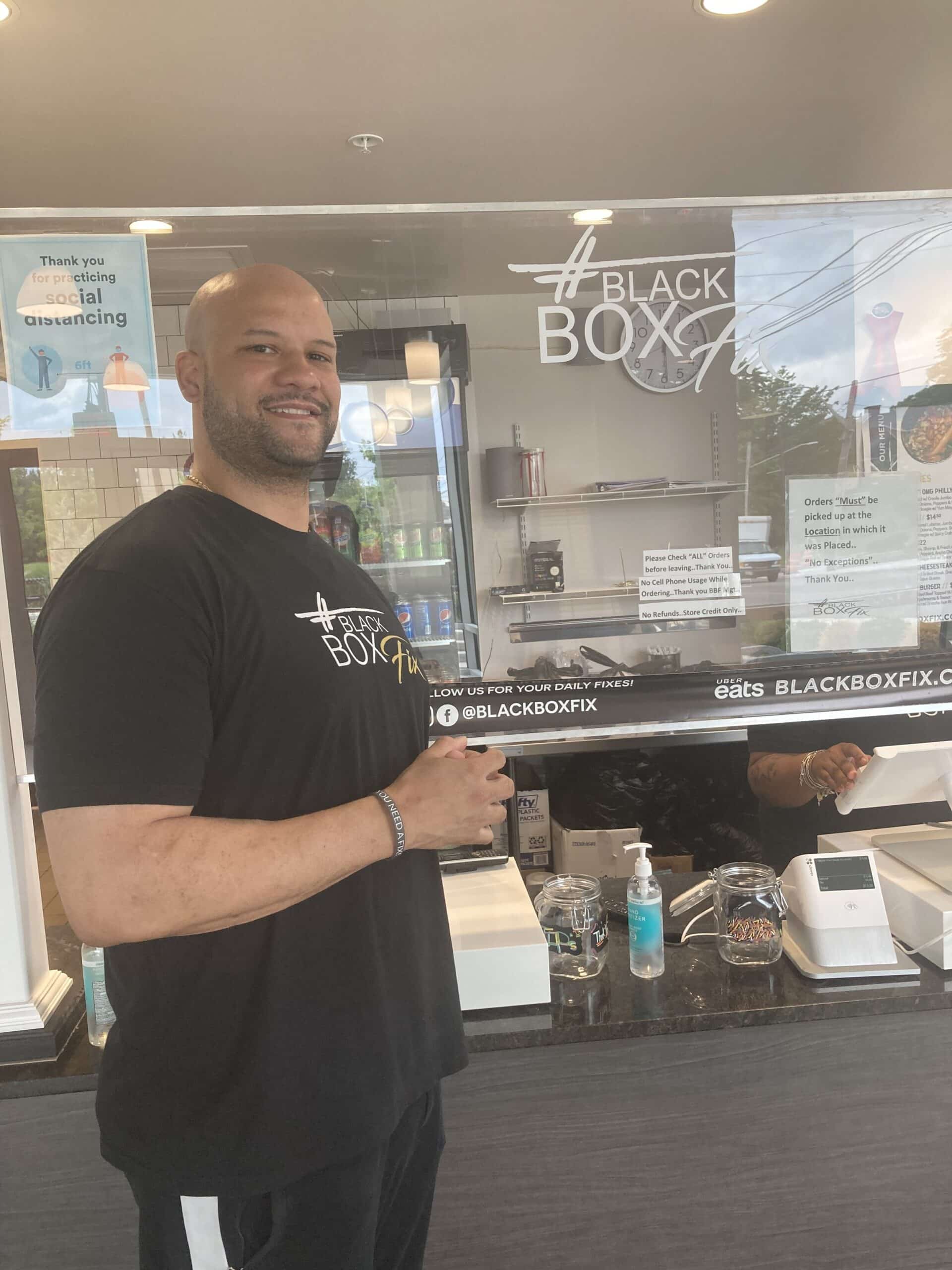 Eric Foster holding down Black Box Fix, which has reopened for business. Contributed photo.