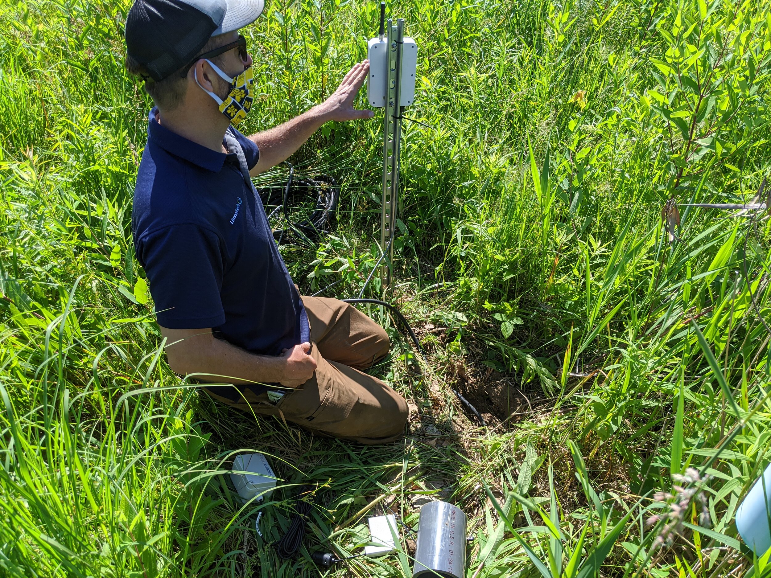 Ed Verhamme (Limnotech) installs soil moisture sensors at Old Woman Creek testbed. Photo courtesy CWA.