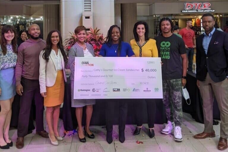 The staff of Cathy’s Gourmet Ice Cream Sandwiches pictured with their novelty-sized check for $40,000. Photo courtesy of Greater Cleveland Partnership.