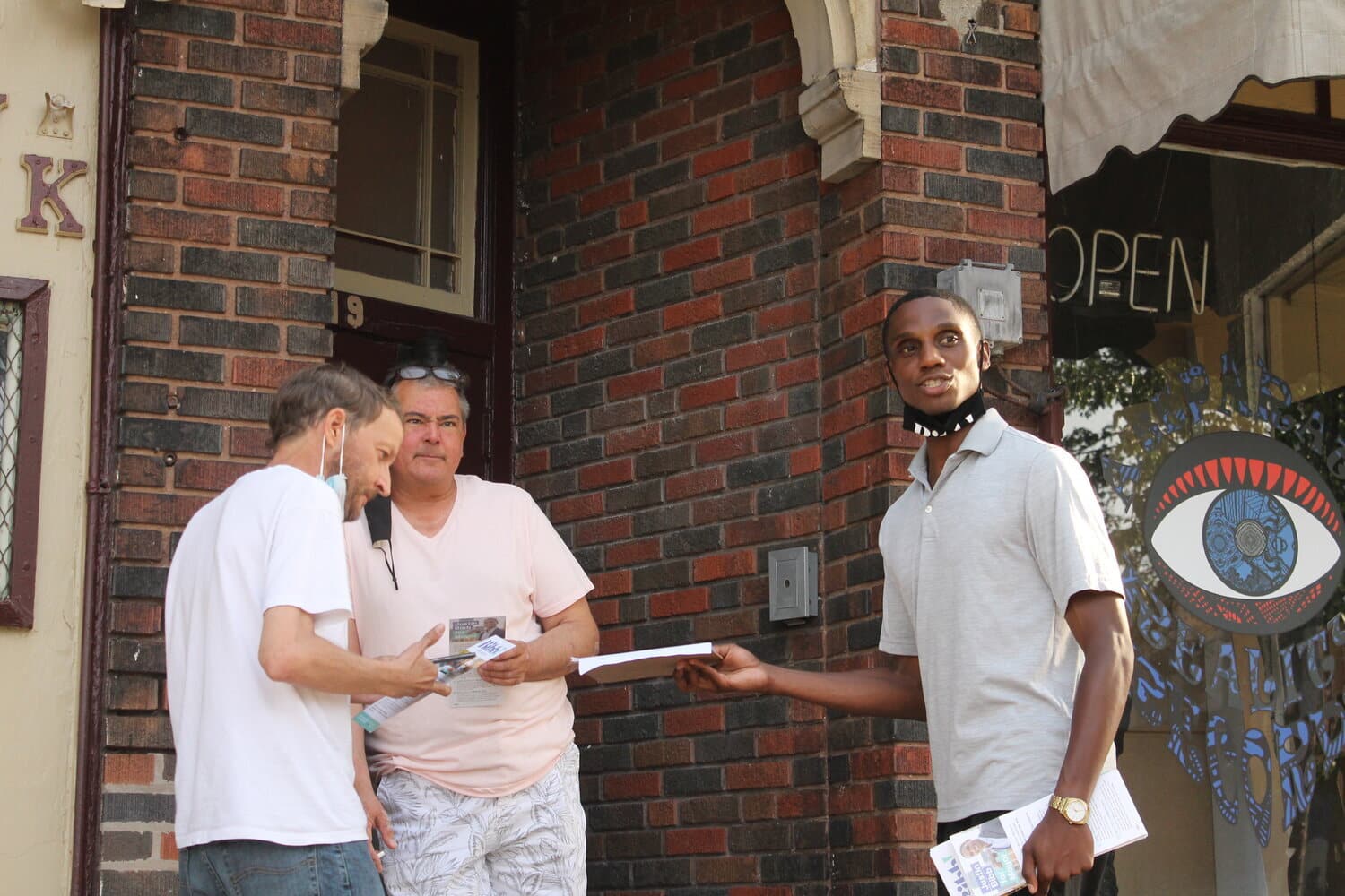34-year-old mayoral candidate Justin Bibb hands out campaign literature to west side Cleveland residents on Detroit Ave. and West 117th St., Thursday, May 20, 2021. (Photo/Mark Oprea)