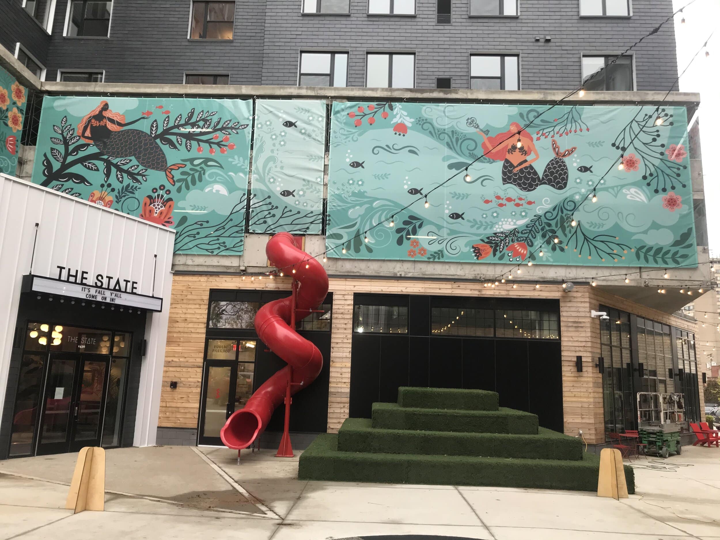  A whimsical slide, seesaw and outdoor seating. 