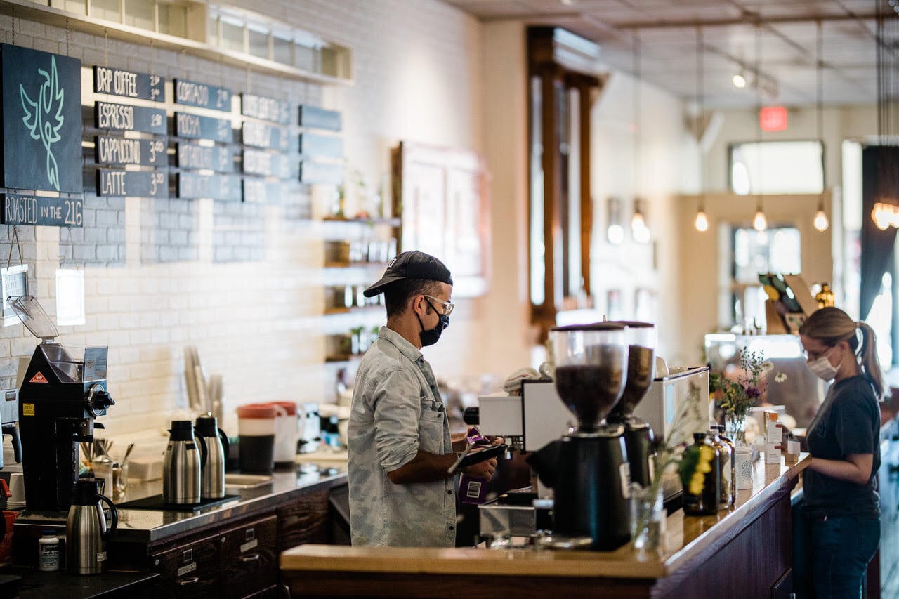 A barista makes coffee at Phoenix’s Lee Rd. location.