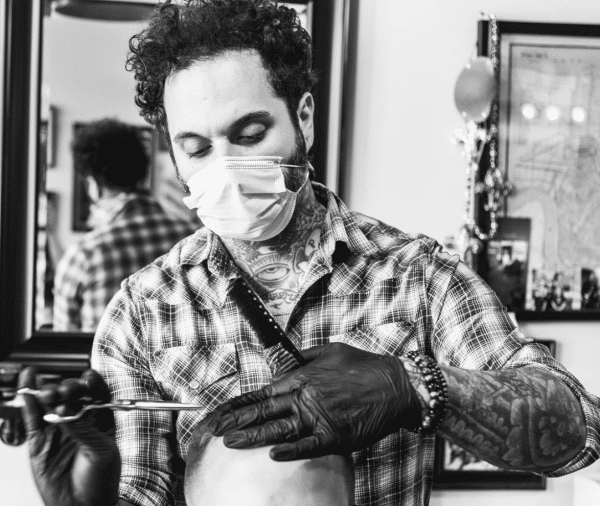 Patrick Corrigan putting on the finishing touches at Black Cat Barbershop