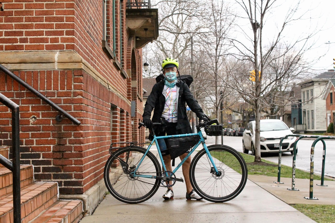 Bike courier Stephen Shaum outside of Phoenix Coffee in Ohio City.