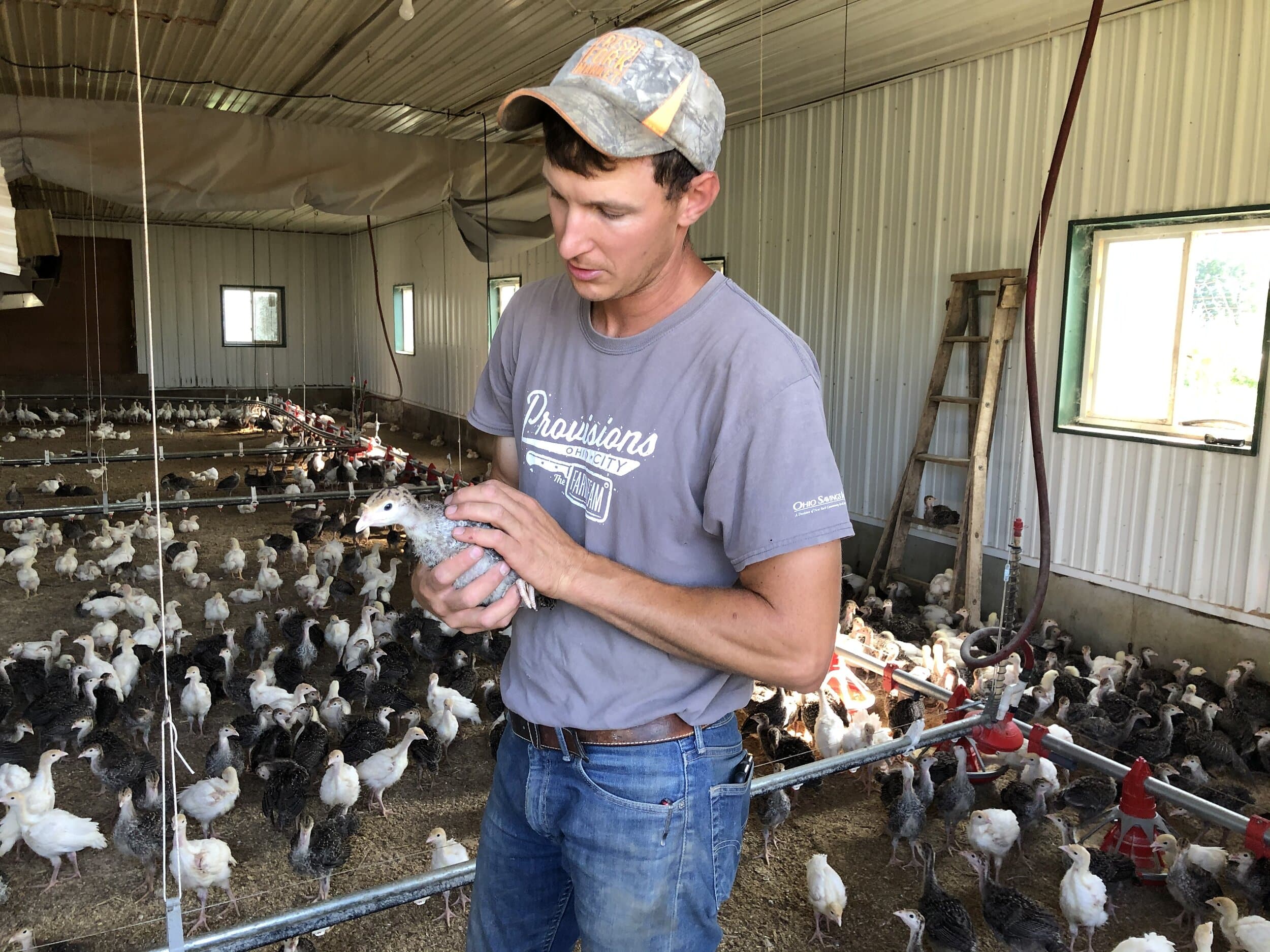 Trevor with a young turkey.JPG