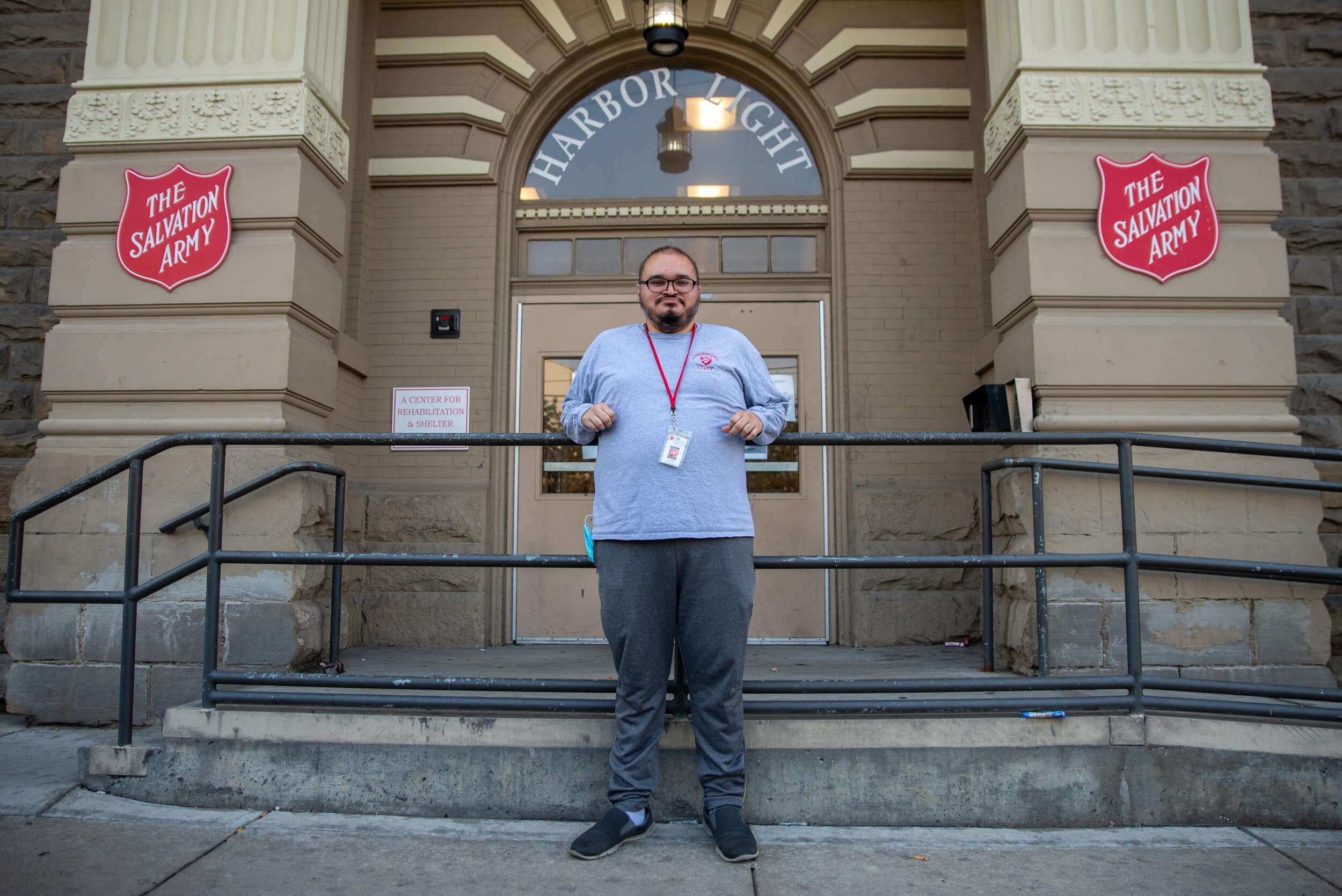 Wilber Argueta stands outside the Zelma George Salvation Army Shelter, where he helped organize online tutoring for 12 homeless youth this summer-1.jpg