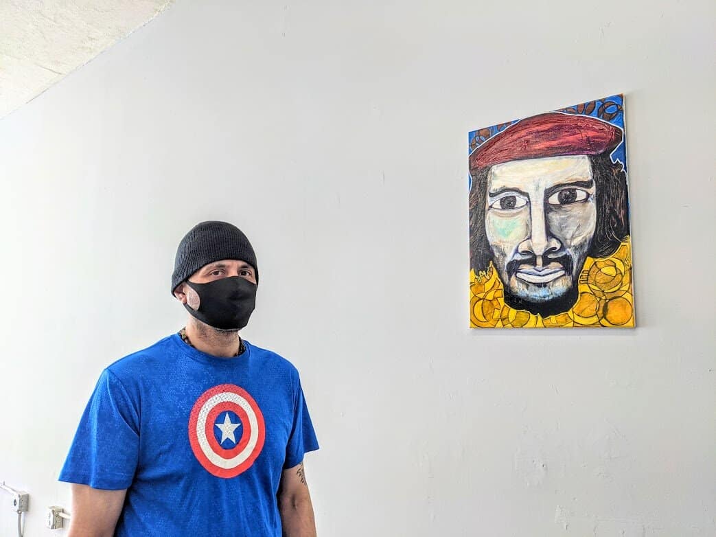 Will Sanchez with his portrait of Che Guevara.jpg