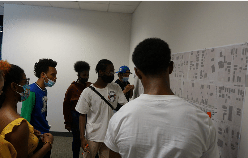 Hough area youth participate in a design session for E. 66th St.