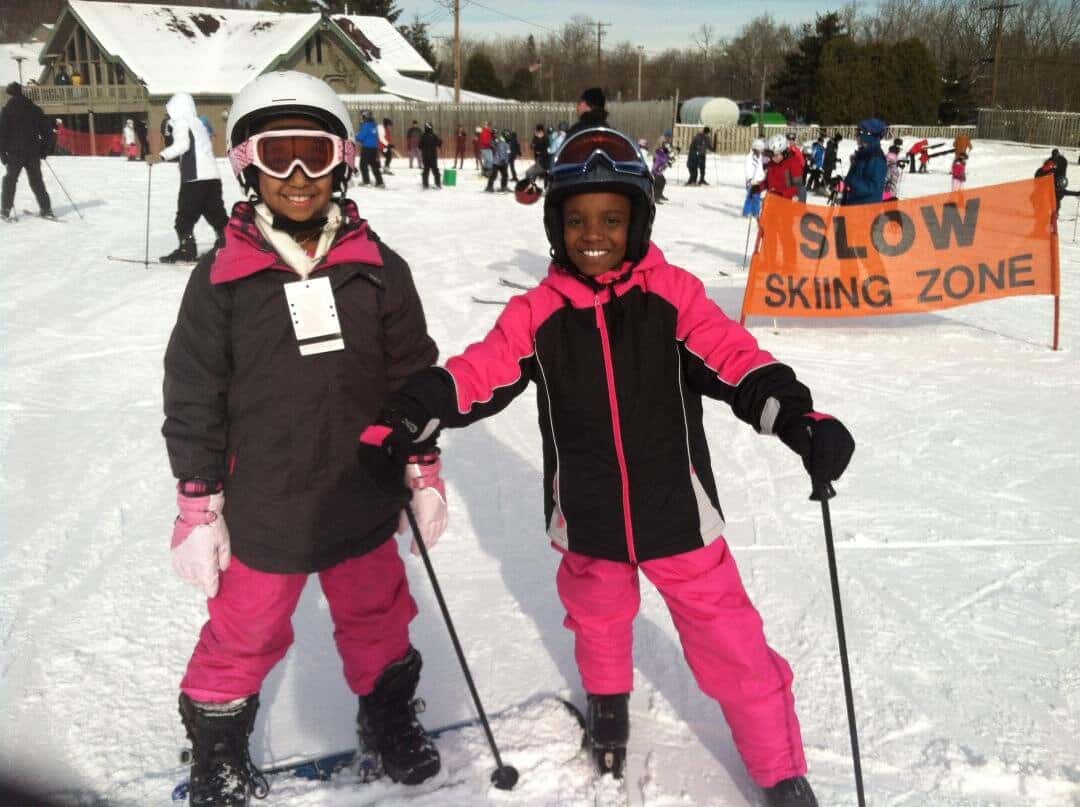 Two participants in the SYATT (See You at the Top) program learn to ski and snowboard at Boston Mills/Brandywine Ski Resort. Photo Courtesy of SYATT.