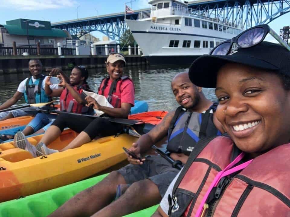 A group with SYATT tries out kayaking on the Cuyahoga River in the Flats. SYATT co-founder Ebony Hood is in the middle. Photo Courtesy of SYATT.
