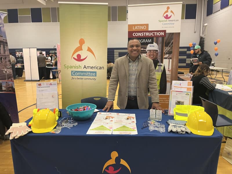 Juan Medina at the Spanish American Committee's booth at the construction opportunity fair