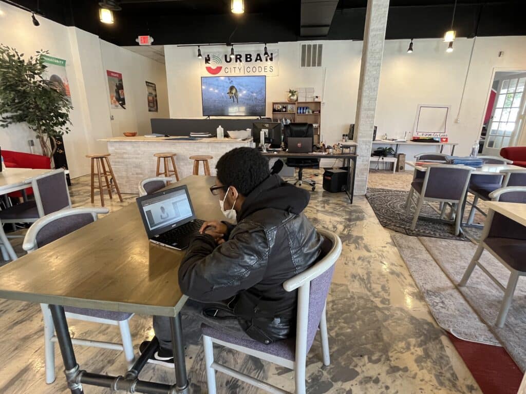 Darreontae Williams working on a computer at Urban City Codes. 