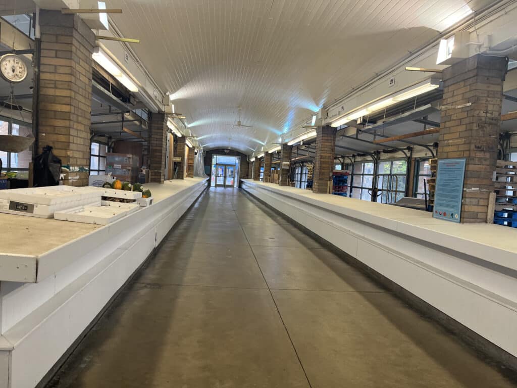 Empty stalls in the Arcade area of the market. 