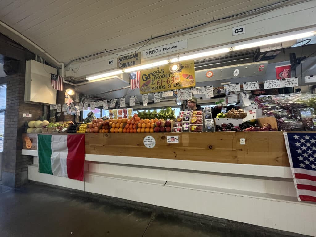 Greg’s Produce owner Jason Scott behind his stand at the Arcade section of the market. 