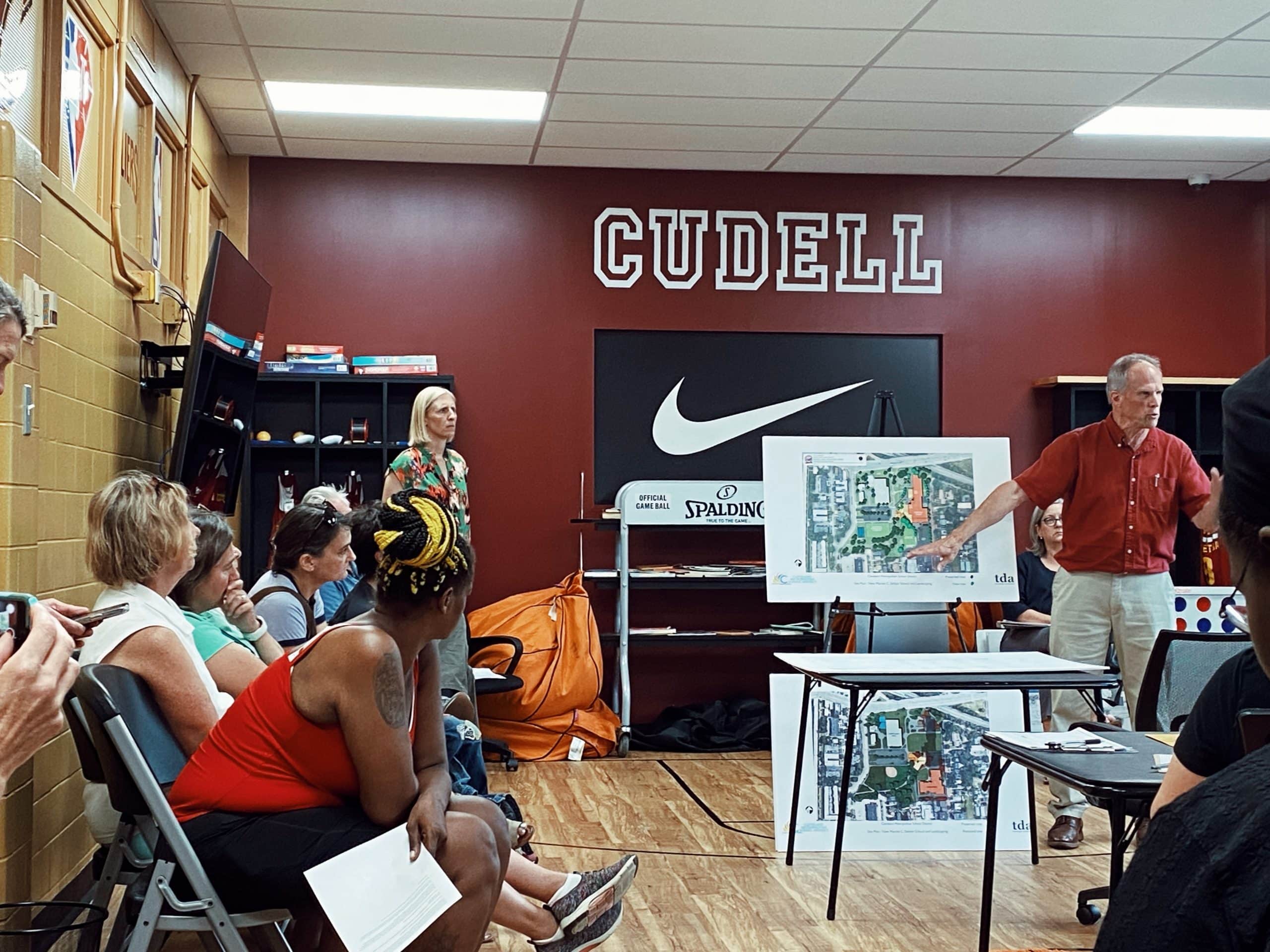 Ward 15 Council Member Jenny Spencer and residents gathered near diagrams of the plans for the school at the Cudell Rec Center.