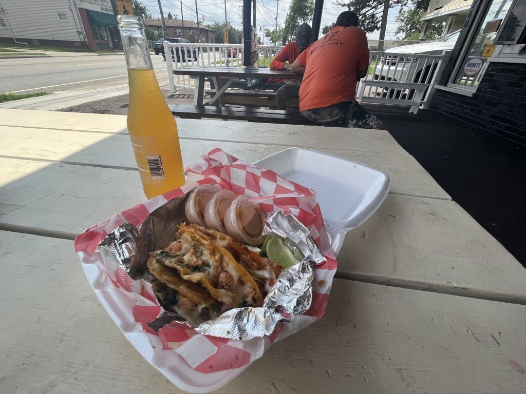 Chicken birria tacos and mango Jarritos soda at Locos Tacos. 