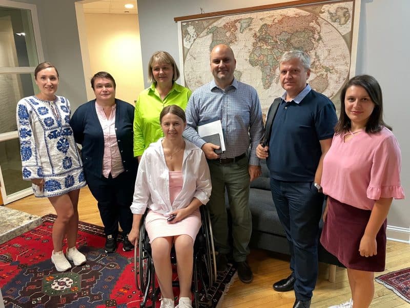 Group photo of The Land's acting executive director Jeff Kipp with the delegation of leaders from Moldova.