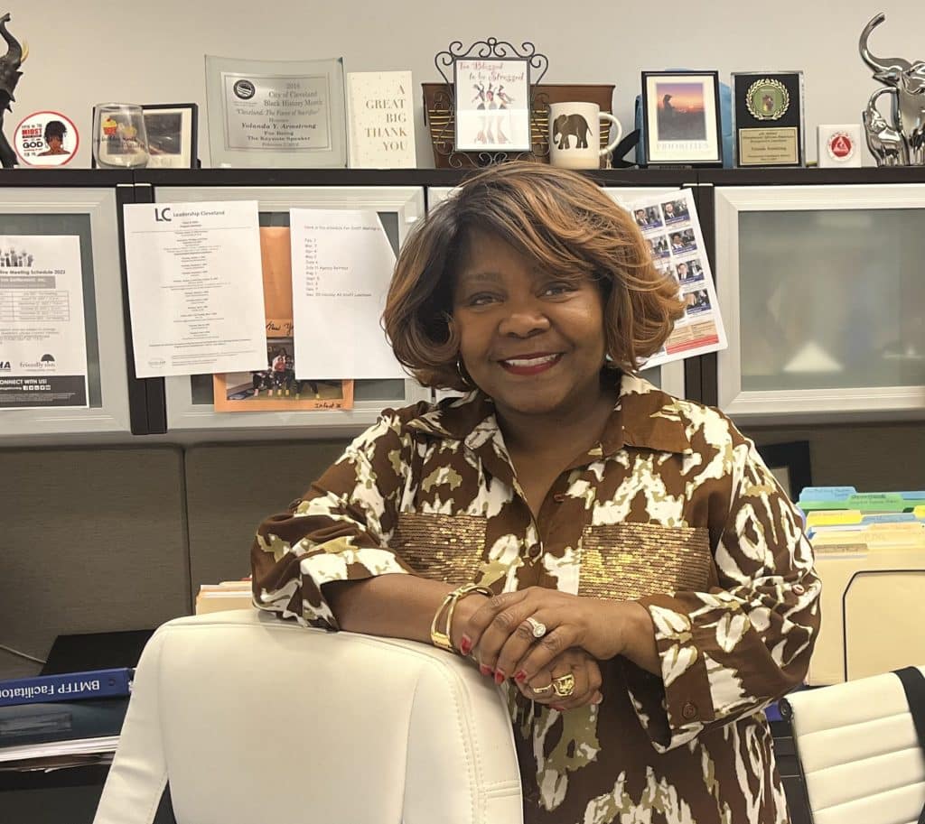 Portrait of Friendly Inn president and CEO Yolanda Armstrong standing in her office. 