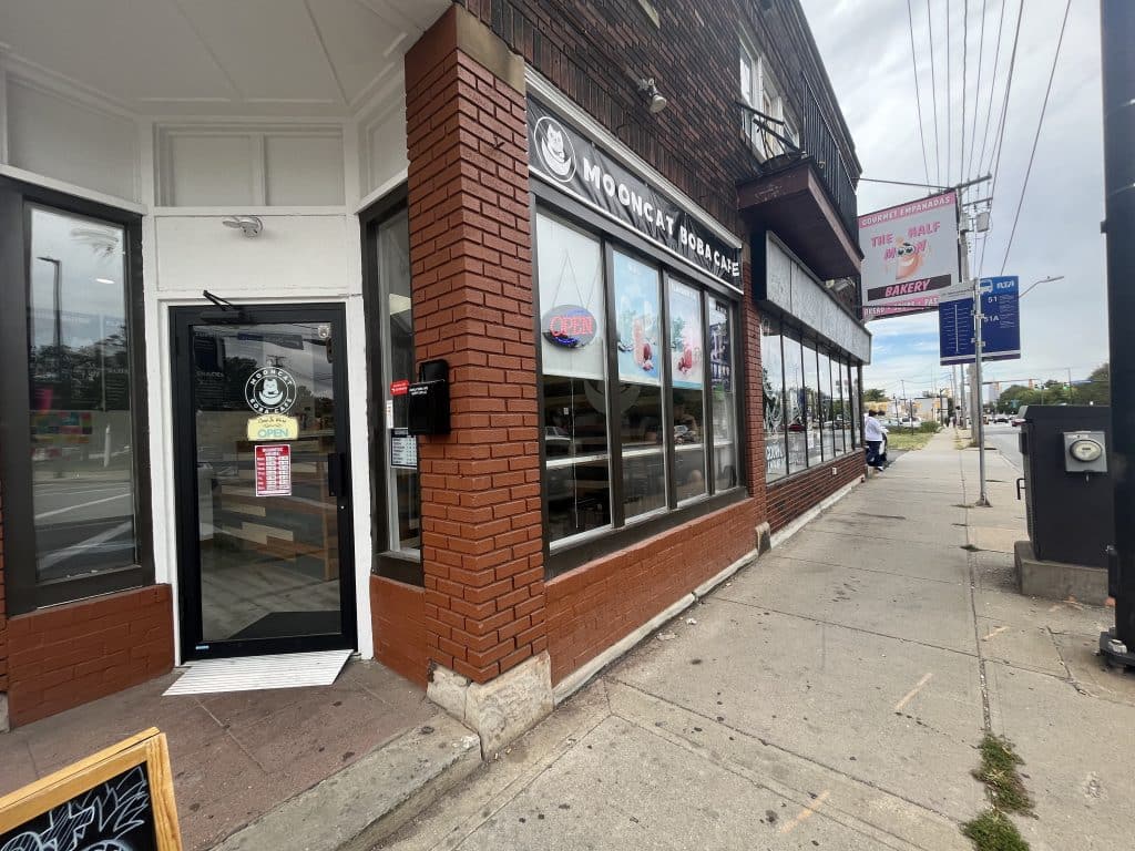 The storefronts of Mooncat Boba Cafe and Bella Luna Bakery.