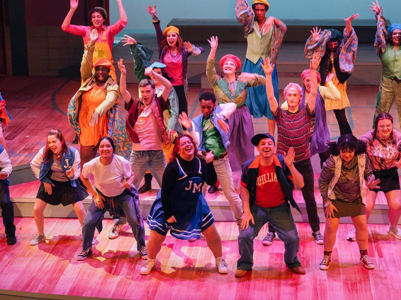 Group of actors on stage performing The Prom
