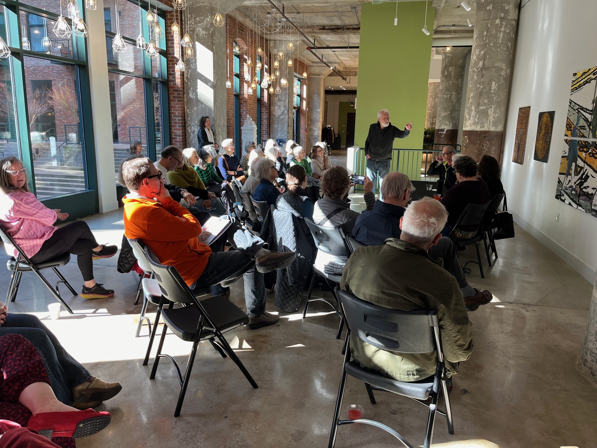 Group of people gathered in an art gallery at the Worthington Yards Apartments in Cleveland's warehouse district
