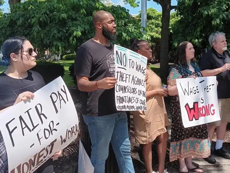 Group of diverse Cleveland residents protest wage theft